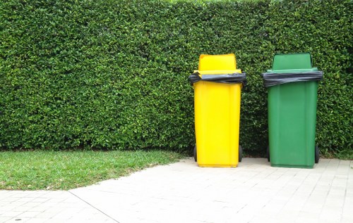 Team removing garden debris in a Weybridge backyard